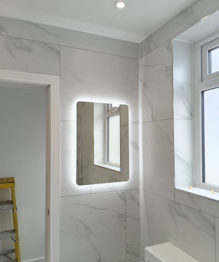 Backlit LED mirror in a bathroom