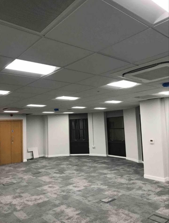 Office with LED ceiling panels lit